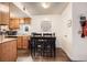 Cozy dining area with a wooden table, chairs, and easy access to kitchen and other living spaces at 1358 S Irving St # 53, Denver, CO 80219