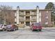 Exterior of a brick apartment building with two stories and multiple balconies at 1358 S Irving St # 53, Denver, CO 80219