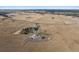 Stunning aerial view of a horse property including estate, equestrian facilities, and vast acreage at 9250 Steeplechase Dr, Franktown, CO 80116