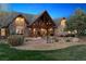 Luxury home with stone patio and firepit at 9250 Steeplechase Dr, Franktown, CO 80116