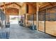 View down the center aisle of the barn at 9250 Steeplechase Dr, Franktown, CO 80116