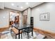 Basement dining area with glass-top table and bench at 9250 Steeplechase Dr, Franktown, CO 80116