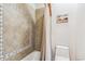 Cozy bathroom showing custom tile work in the tub/shower, along with neutral colors and modern fixtures at 9250 Steeplechase Dr, Franktown, CO 80116