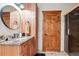 Basement bathroom with vanity and access to sauna at 9250 Steeplechase Dr, Franktown, CO 80116