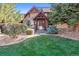 House exterior with manicured lawn and stone accents at 9250 Steeplechase Dr, Franktown, CO 80116