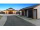 Exterior view of barn featuring two spacious buildings and a long driveway at 9250 Steeplechase Dr, Franktown, CO 80116