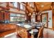 Spacious kitchen with island seating and wooden cabinets at 9250 Steeplechase Dr, Franktown, CO 80116