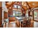Gourmet kitchen boasts a large island, high-end appliances, and wood beams enhancing the space at 9250 Steeplechase Dr, Franktown, CO 80116