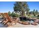 Relaxing pond and waterfall with patio chairs at 9250 Steeplechase Dr, Franktown, CO 80116