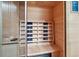 Beautiful home sauna featuring natural wood interior with built-in seating at 9250 Steeplechase Dr, Franktown, CO 80116