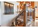 Elegant staircase with wood and metal accents at 9250 Steeplechase Dr, Franktown, CO 80116