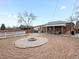 Backyard with fire pit, patio furniture, and gravel at 11310 Irma Dr, Northglenn, CO 80233