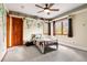 Charming bedroom with natural light, ceiling fan, and fun cartoon decor at 2122 Cramner Ct, Evergreen, CO 80439