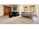 Bright bedroom with closet, sitting area, wood trim windows with beautiful neighborhood and wooded exterior views at 2122 Cramner Ct, Evergreen, CO 80439
