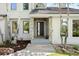A modern front entrance with stone accents and a contemporary door welcomes you home at 2122 Cramner Ct, Evergreen, CO 80439