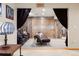 Home theater with comfortable leather seating, overhead projector, theatrical curtains and textured wood walls at 2122 Cramner Ct, Evergreen, CO 80439
