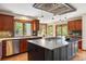 Well-appointed kitchen features a large island, wood cabinetry, and modern stainless steel appliances at 2122 Cramner Ct, Evergreen, CO 80439