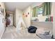 Playful playroom with a whimsical teepee, cozy seating, and natural light at 2122 Cramner Ct, Evergreen, CO 80439