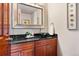 Elegant powder room with granite countertop and modern vessel sink at 2122 Cramner Ct, Evergreen, CO 80439