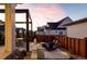 Outdoor backyard area showcasing a patio with dining table and seating, plus a fire pit with chairs at 5985 Galena St, Denver, CO 80238