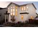 Beautiful two-story home featuring large windows, neutral siding, and a well-maintained front yard at 5985 Galena St, Denver, CO 80238