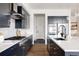 Well-equipped kitchen with stainless steel appliances, sleek countertops, ample storage, and an island with bar seating at 5985 Galena St, Denver, CO 80238