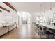Bright open living space connects to the kitchen, offering a seamless flow for entertaining and daily living at 5985 Galena St, Denver, CO 80238