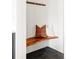 Cozy mudroom nook with a live edge bench and decorative pillows offers a welcoming spot at 5985 Galena St, Denver, CO 80238