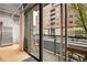 Enjoy city views from this home's balcony with sliding glass doors and wood floors at 1401 Wewatta St # 202, Denver, CO 80202