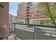 Enjoy city views from the home's cozy balcony with room to sit and relax at 1401 Wewatta St # 202, Denver, CO 80202
