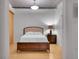 Bright bedroom with neutral walls, modern lighting, and hardwood floors provides a relaxing space at 1401 Wewatta St # 202, Denver, CO 80202