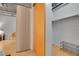 Walk-in closet with custom storage solutions, featuring light wood accents and practical design for organizing at 1401 Wewatta St # 202, Denver, CO 80202