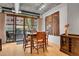 Cozy dining room features a modern chandelier, wood floors and direct access to balcony at 1401 Wewatta St # 202, Denver, CO 80202