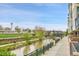Enjoy the walking paths and views from the home's patio with mature landscaping at 1401 Wewatta St # 202, Denver, CO 80202