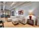 This light-filled living room offers a spacious seating area, modern lighting, and beautiful bamboo floors at 1401 Wewatta St # 202, Denver, CO 80202