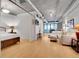 Open-concept living area with a partition wall includes bamboo floors, modern decor, and exposed ductwork at 1401 Wewatta St # 202, Denver, CO 80202