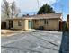 Backyard of house includes brick details, with new patio area, and well kept grass at 1801 S Grove St, Denver, CO 80219