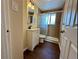 Updated bathroom featuring a glass-enclosed shower and a modern vanity at 1801 S Grove St, Denver, CO 80219