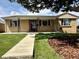 Charming brick home with a well-manicured lawn and inviting walkway at 1801 S Grove St, Denver, CO 80219