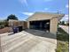 Spacious detached garage with a concrete driveway and ample storage at 1801 S Grove St, Denver, CO 80219