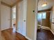 Hallway view of updated bathroom and additional storage at 1801 S Grove St, Denver, CO 80219