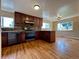Bright kitchen with dark cabinets, granite countertops, and stainless appliances at 1801 S Grove St, Denver, CO 80219