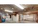 Unfinished basement features wood-paneled ceiling, utility access, and open layout at 9040 Raleigh St, Westminster, CO 80031