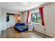 Modest bedroom with red curtains and a window view at 9040 Raleigh St, Westminster, CO 80031