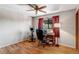 Bright bedroom with hardwood floors, a ceiling fan, and ample natural light for a home office space at 9040 Raleigh St, Westminster, CO 80031