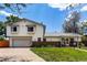 Two-story home with attached garage, brick accents, and well-maintained lawn at 9040 Raleigh St, Westminster, CO 80031