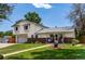 Inviting two-story home with well-maintained lawn, a covered front porch, and attached garage at 9040 Raleigh St, Westminster, CO 80031
