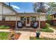 Cozy front porch with seating, brick accents, and tidy landscaping for a welcoming entrance at 9040 Raleigh St, Westminster, CO 80031