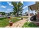 Charming home with well-manicured lawn, stone walkway, and inviting front porch at 9040 Raleigh St, Westminster, CO 80031