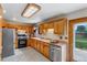 Traditional kitchen featuring wood cabinets, stainless steel appliances, and plenty of counter space at 9040 Raleigh St, Westminster, CO 80031